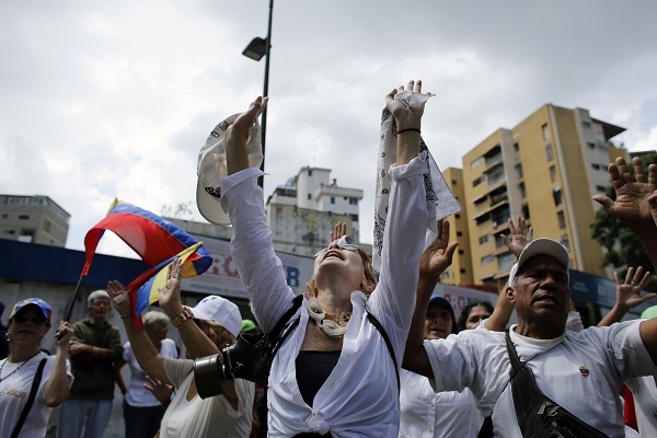 Protestors March In Silence to Honor 20 Dead